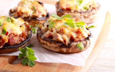 Stuffed portobello mushroom cups on board