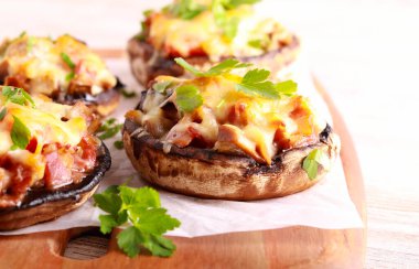 Stuffed portobello mushroom cups on board