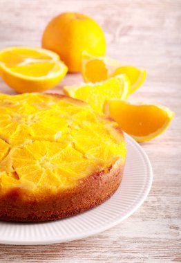 Orange upside down cake, sliced and served