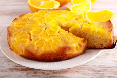 Orange upside down cake, sliced and served
