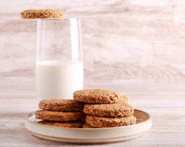 Oat and bran biscuits with glass of milk