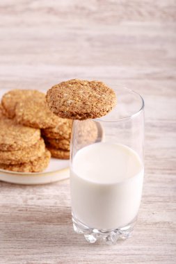 Oat and bran biscuits with glass of milk