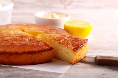 Lemon cake, sliced and served with curd clipart