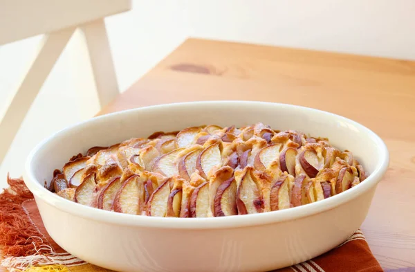 Peach and coconut cake, in a tin