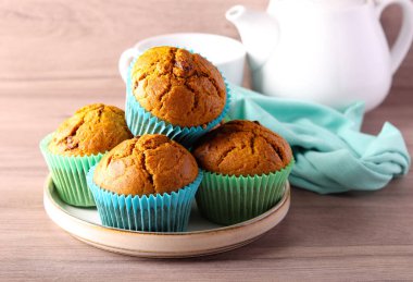 Pumpkin muffins with raisin, served clipart