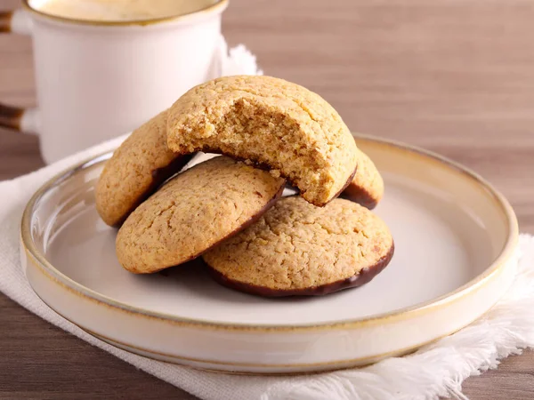 Whole wheat cookies with wheat germ, coated in chocolate
