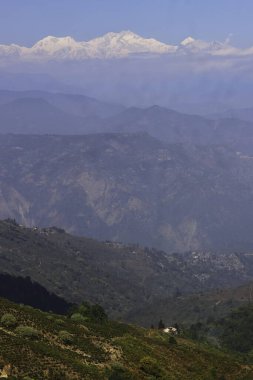 scenic mountain landscape and snowcapped mount kangchenjunga peak from darjeeling hill station in west bengal, india