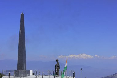 beautiful batasia loop war memorial and snowcapped himalaya peak mount kangchenjunga, darjeeling hill station in west bengal, india