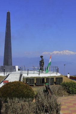 beautiful batasia loop war memorial and snowcapped himalaya peak mount kangchenjunga, darjeeling hill station in west bengal, india