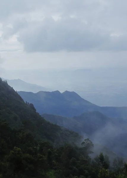 rain bearing monsoon clouds over western ghats mountains in south india, in late summer season