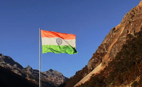 indian flag is flying over the sky near india china border (mcmahon line) in tawang area of arunachal pradesh, north east india
