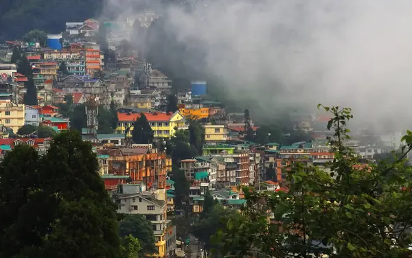 stock image clouds are floating over beautiful darjeeling hill station in monsoon season, panoramic view of townscape and himalaya mountain foothills, india