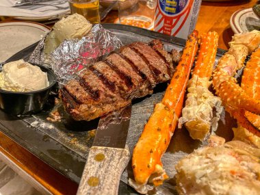 Yummy Steak and Crab Legs - image