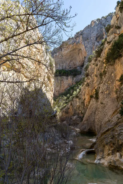 stock image Hanging walkways nailed into the rock that runs inside the Vero river canyon in Alquezar, Aragon, Spain.