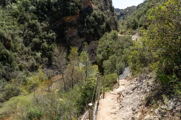 stock image Hanging walkways nailed into the rock that runs inside the Vero river canyon in Alquezar, Aragon, Spain.