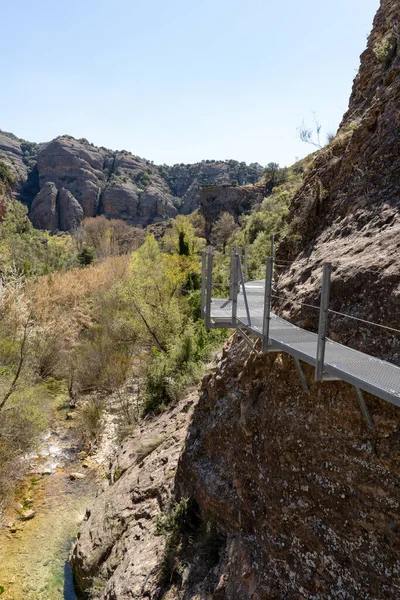 Stock image Hanging walkways nailed into the rock that runs inside the Vero river canyon in Alquezar, Aragon, Spain.