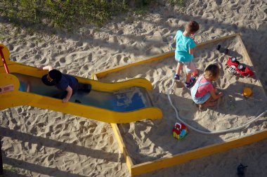Kyiv, Ukraine June 20, 2022: Children play outside in the playground