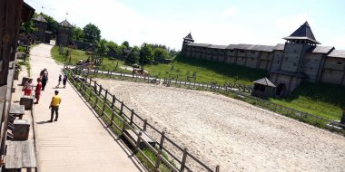 Kiev, Ukraine June 19, 2021: old wooden fortress - entertainment complex Kievan Rus old wooden fortress and artists doing a performance.