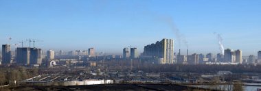 Kyiv, Ukraine March 27, 2024: Chimneys smoke, polluting the air in the city and worsening the environment clipart