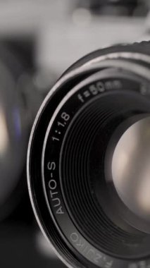 Detail of analog camera from the 80s. Photography of film roll being used. 