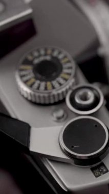 Detail of analog camera from the 80s. Photography of film roll being used.
