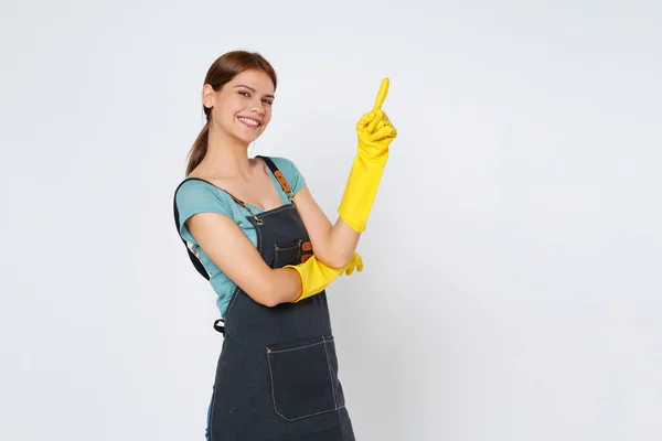 Young Woman Wearing Yellow Rubber Gloves Hands Protection Pointing Empty — Stock Photo, Image