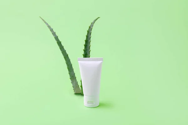 Blank cosmetics tube with aloe vera on background.Organic cosmetic concept.