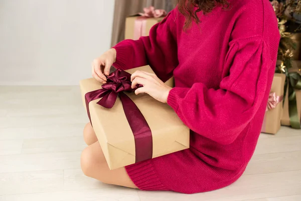 Anonymous woman holding gift box in hands,festive concept.