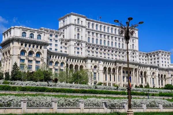 Stock image The Palace of the Parliament also known as People's House (Casa Popoprului) in Constitutiei Square (Piata Constitutiei) in Bucharest, Romania, in a sunny spring day