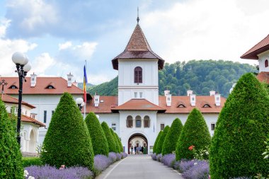 Sambata, Romania, 17 July 2021 - Main alley towards Brancoveanu Orthodox Monastery (Manastirea Brancoveanu) in a village in Brasov county in the southern part of Transylvania (Transilvania) region