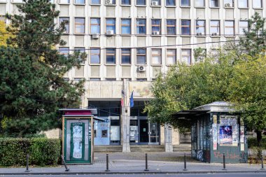 Bucharest, Romania, 7 November 2021: Main building and entry of the Bucharest University (or Academy) of Economic Studies (ASE) in a sunny autumn day