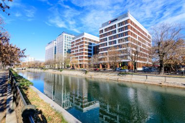 Bucharest, Romania, 20 Nov 2021: Modern glass business buildings at Timpuri Noi area with headquarters of Platika, Tremend, Zitec in a sunny autumn day 