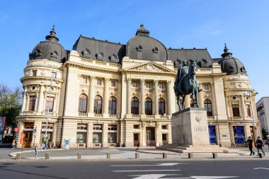 Bucharest, Romania - 6 November 2021: The Central University Library with equestrian monument to King Carol I in front of it in Revolutiei Square (Piata Revolutiei) in Victoriei Avenue (Calea Victoriei)