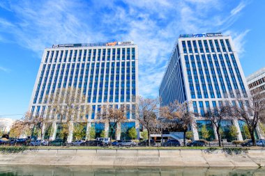 Bucharest, Romania, 20 Nov 2021: Modern glass business buildings at Timpuri Noi area with headquarters of Platika, Tremend, Zitec in a sunny autumn day
