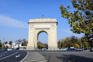 Bucharest, Romania - 6 November 2021:  Arcul de Triumf (The Arch Of Triumph) triumphal arch and landmark, located in the Northern part of the city on Kiseleff Road near King Michael I (Herastrau) Park