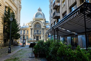 Bucharest, Romania, 20 November 2021: Old buildings with bars and restaurants on Lipscani Street (Strada Lipscani) in the historical center (Centrul Vechi) in a sunny autumn day