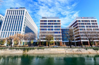 Bucharest, Romania, 20 Nov 2021: Modern glass business buildings at Timpuri Noi area with headquarters of Platika, Tremend, Zitec in a sunny autumn day
