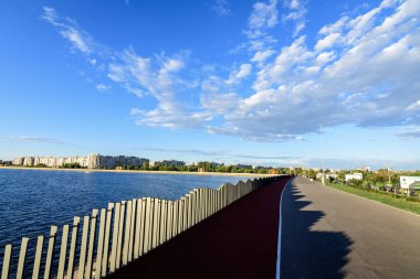 Bucharest, Romania, 25 September 2022: Landscape over the Crangasi Park and Morii Lake (Lacul Morii) or Dambovita Lake in a sunny autumn afternoon clipart