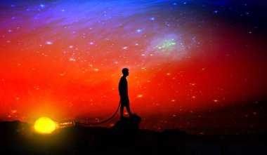 Gün batımının arka planında sırt çantalı bir adamın silueti.