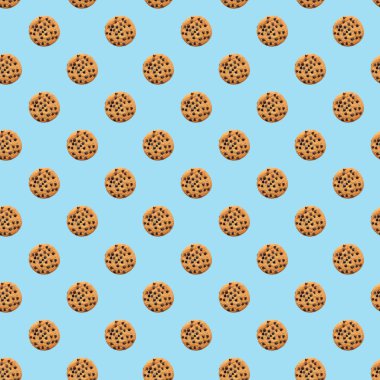 Mavi arka planda çikolata damlaları olan kurabiye deseni. Kurabiye arka planı. Üst manzara, düz uzanma