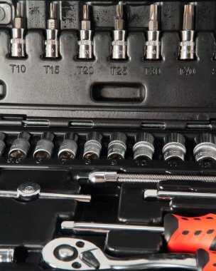 Repair tools in a plastic suitcase, close-up, floating focus.