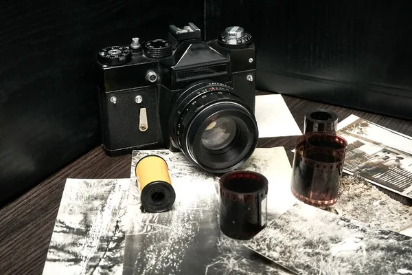 Old vintage camera, rolls of film, old close up shots, floating focus, small film grain.