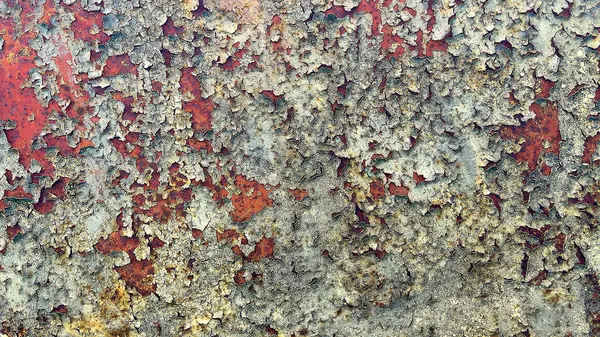 Metal yüzeydeki pas ve soyulmuş boya dokusu. Soyut endüstriyel arkaplan, tasarım projeleri, posterler ve grafik örtüleri için mükemmel.