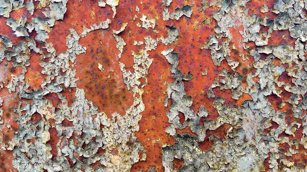Metal yüzeydeki pas ve soyulmuş boya dokusu. Soyut endüstriyel arkaplan, tasarım projeleri, posterler ve grafik örtüleri için mükemmel.