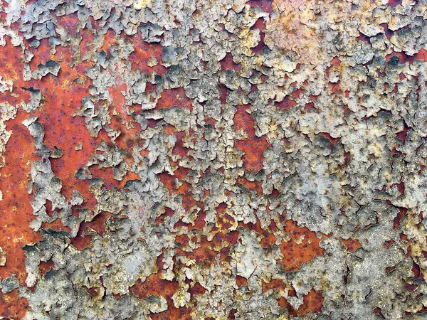 Metal yüzeydeki pas ve soyulmuş boya dokusu. Soyut endüstriyel arkaplan, tasarım projeleri, posterler ve grafik örtüleri için mükemmel.