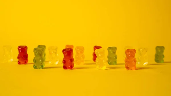 Jelly bears gang. Bright gummy bears group. Colorful sugar candy. Sweet addiction. Teddy jelly bear.