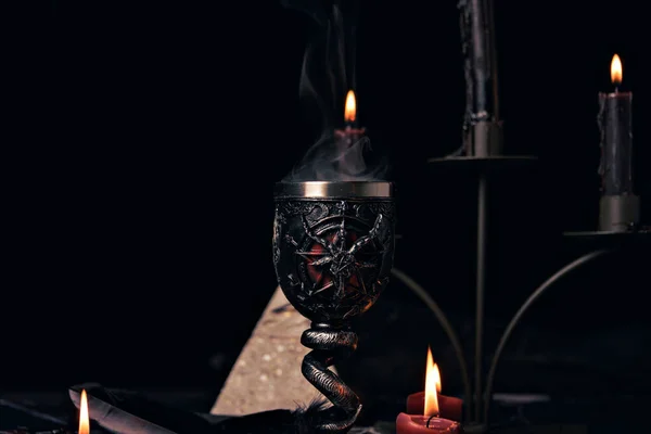 stock image Witchcraft composition with candles, magic book and pentagram symbol. Altar for satanic rituals. Black magic and occult objects