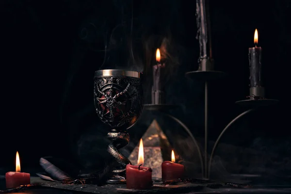 stock image Witchcraft composition with candles, magic book and pentagram symbol. Altar for satanic rituals. Black magic and occult objects