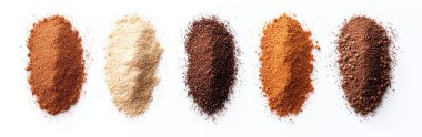 Various coffee grounds in different shades arranged in a row on a white background, showcasing diversity in coffee types and roasts. clipart