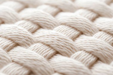 A close-up view of intricately woven fibers displaying a soft beige texture. Ideal for backgrounds, textiles, and design projects focused on natural materials. clipart